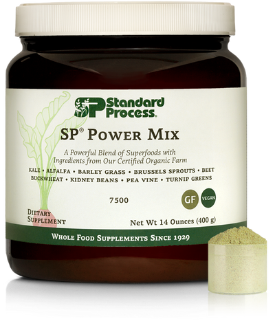 Tub of SP Power Mix next to a scoop of the green powder.
